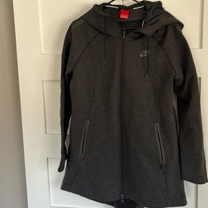 Nike size medium high low jacket with insulation.